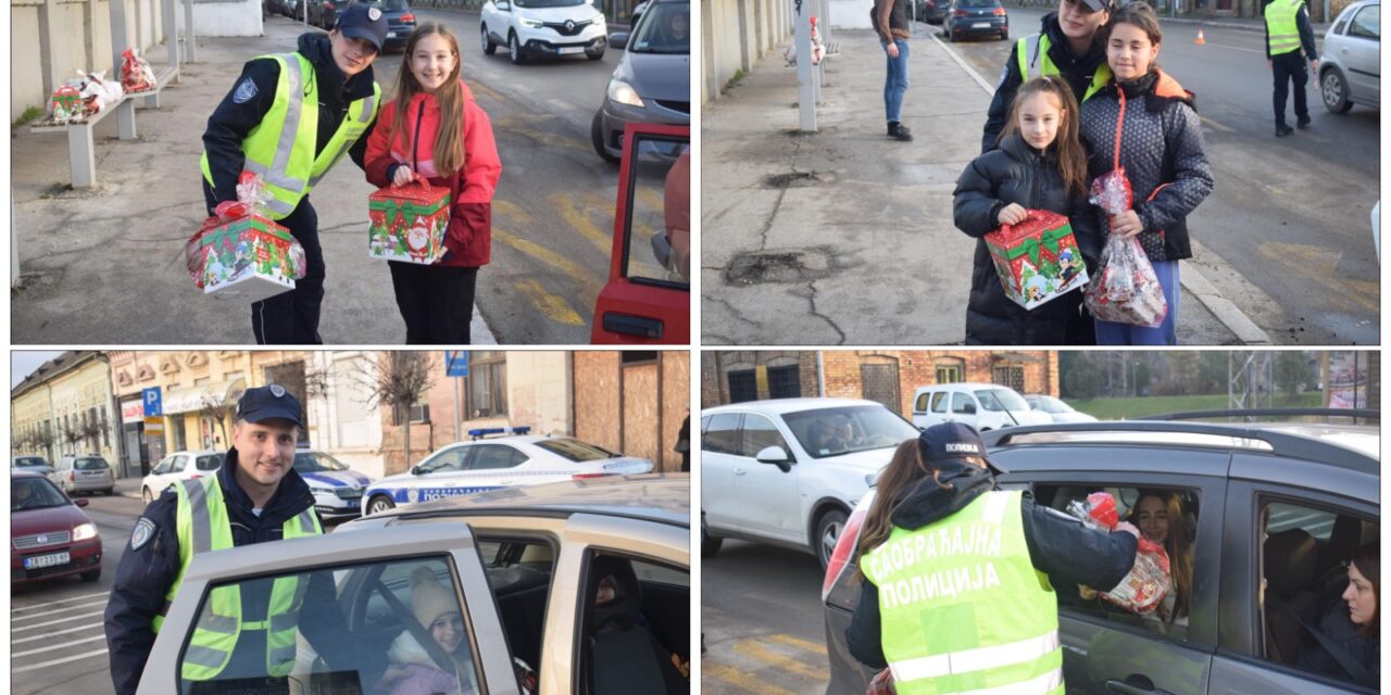 Policijski službenici na Badnji dan prilikom kontrole saobraćaja podelili paketiće najmlađima